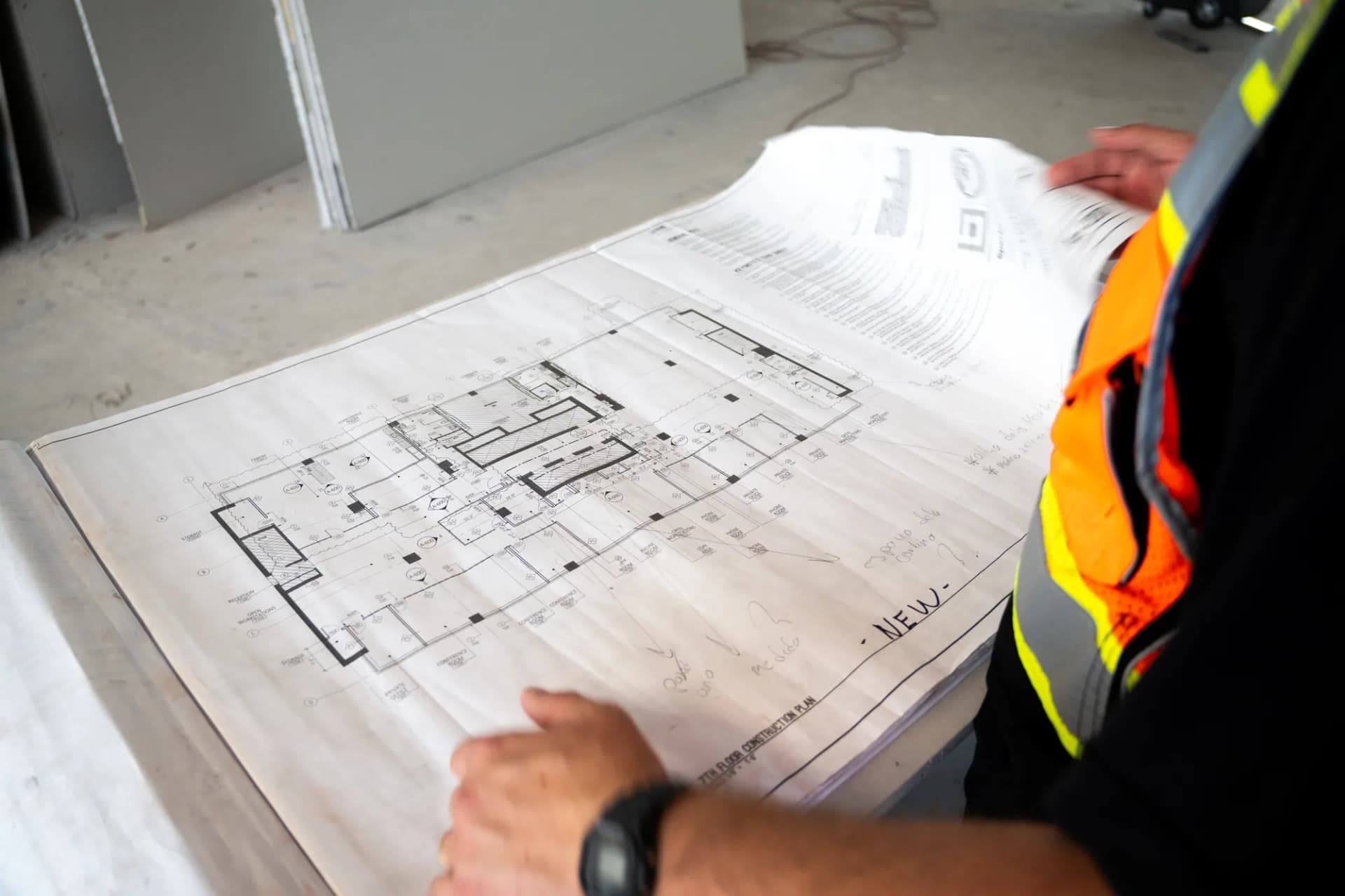 JZ team member reviewing drawings at 100 Biscayne