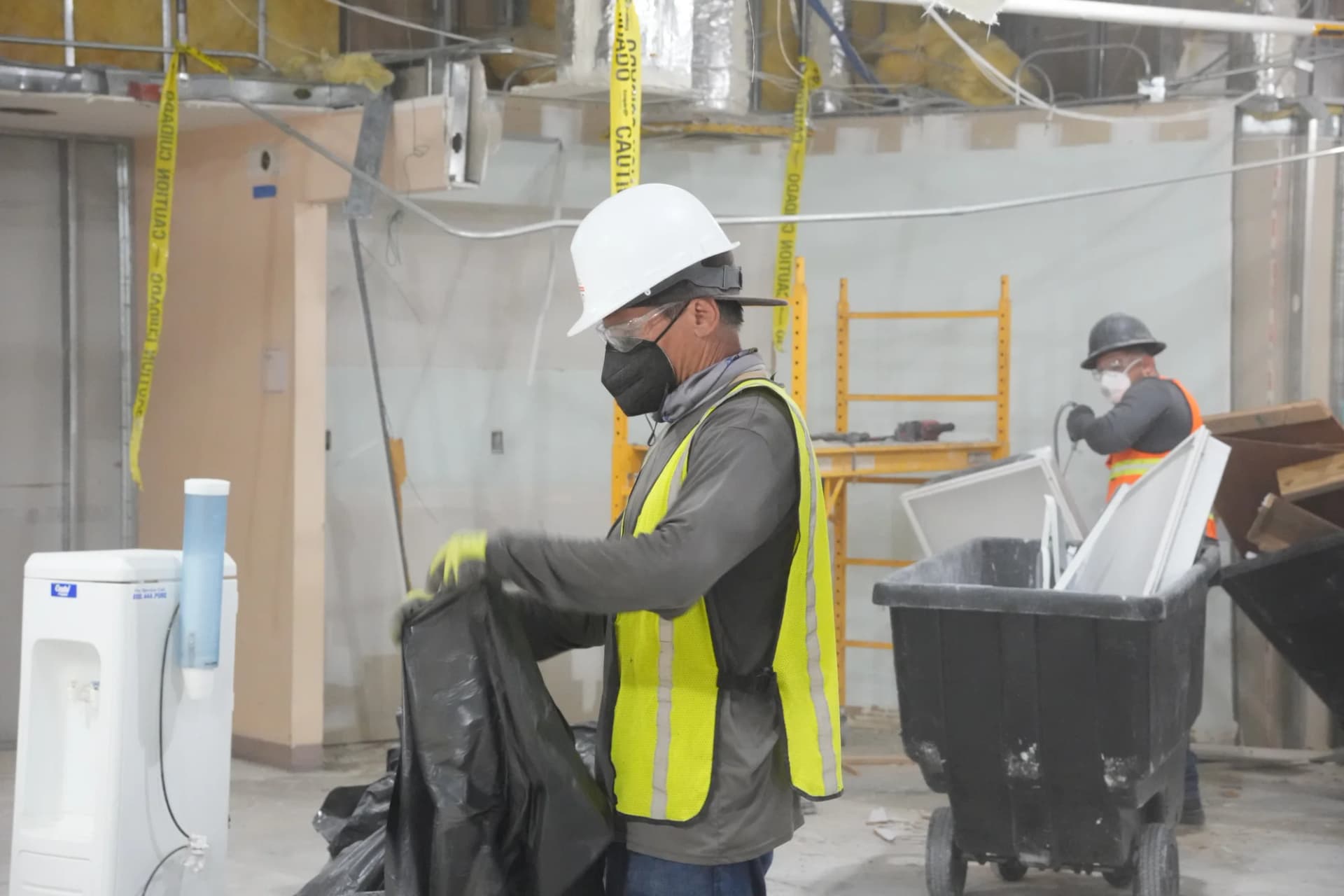 JZ crew member bagging interior demolition debris at MOB Pompano