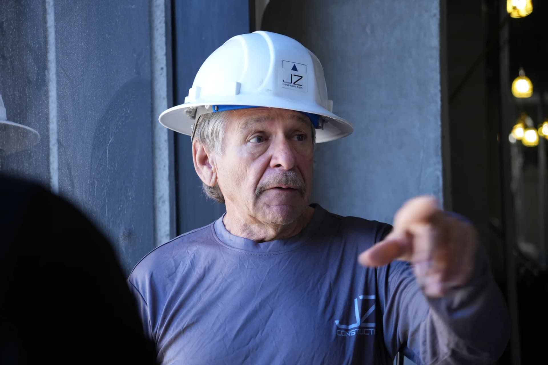 JZ Construction team member discussing work at Bascom Palmer